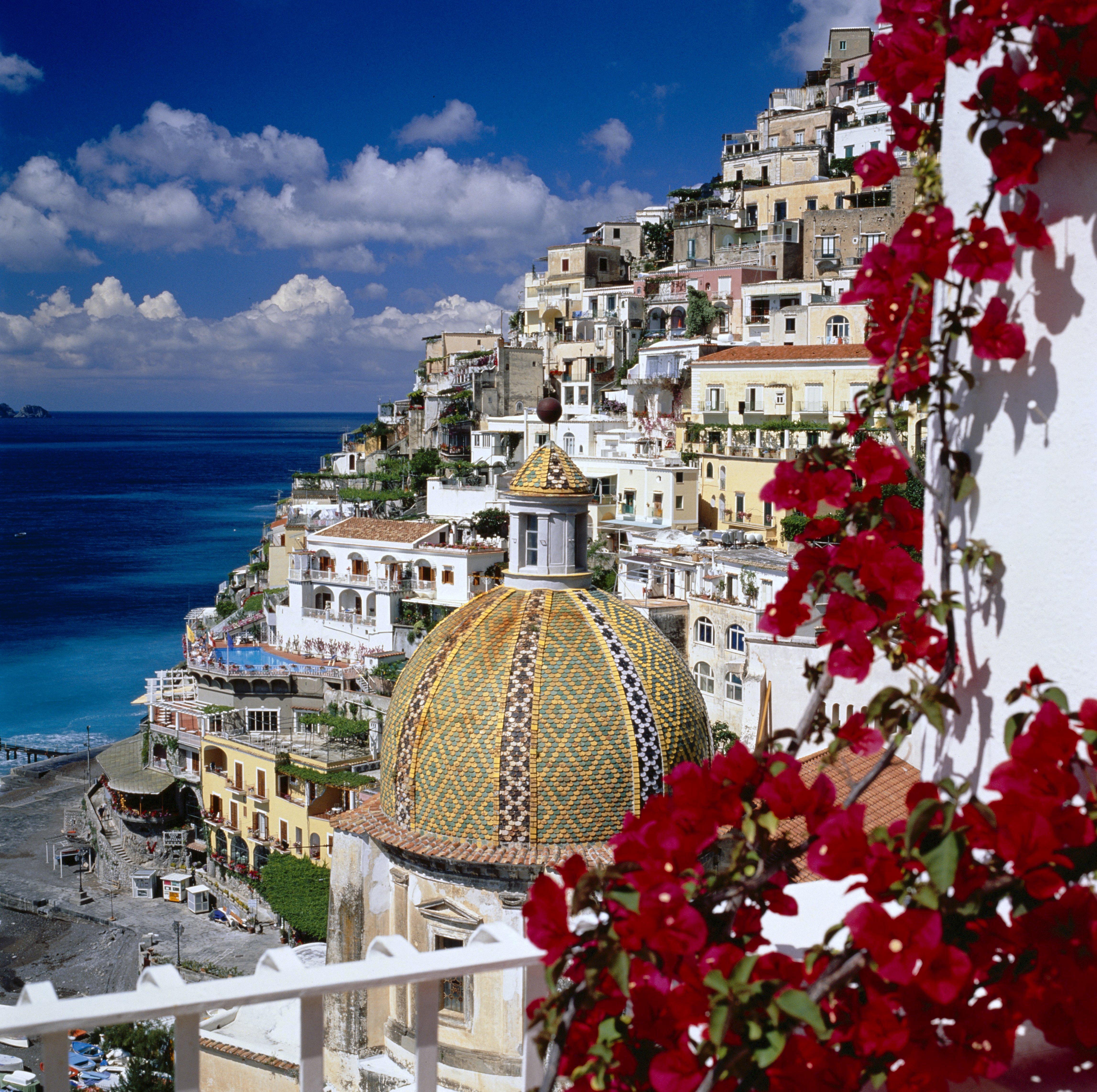 Mandatory Credit: THE TRAVEL LIBRARY / Rex Features Ltd. VIEW OF TOWN WITH CHURCH DOME POSITANO, ITALY RED FLOWER FLOWERS STEEP HILL HILLSIDE