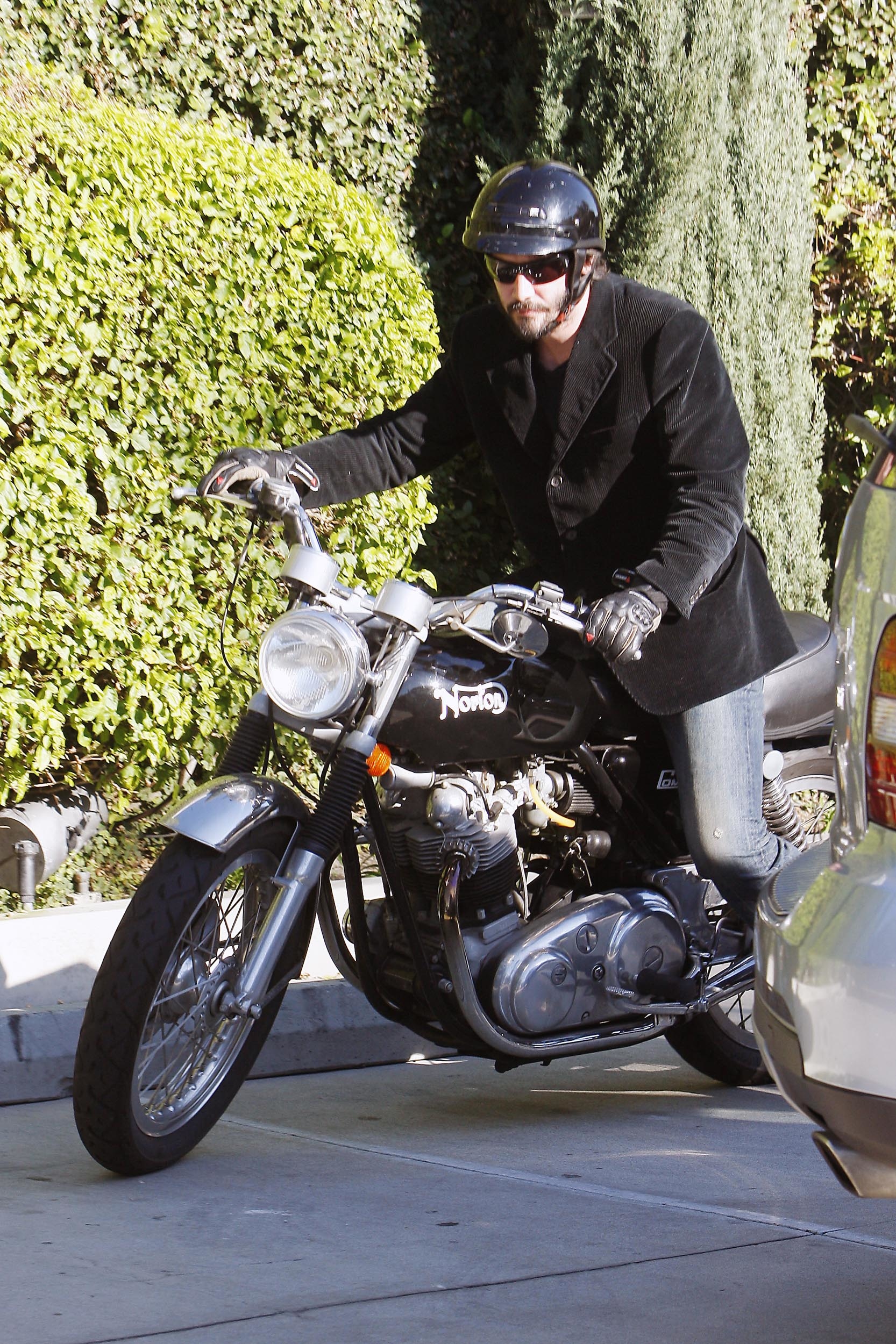 KEANU REEVES OUT ON HIS BIKE.