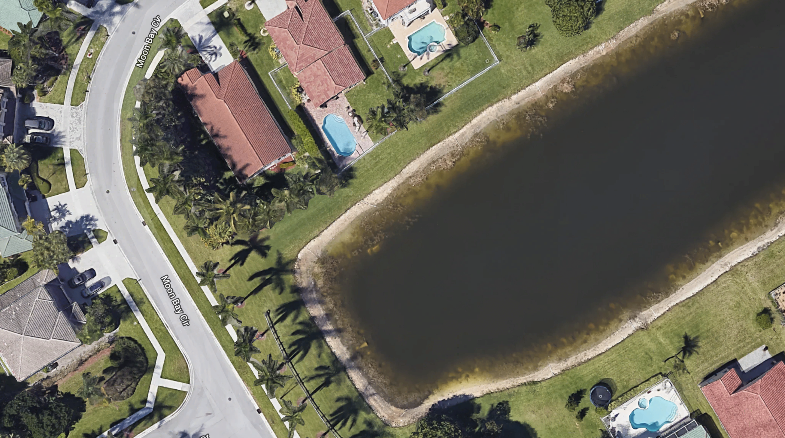 Beeld Google Earth auto met skelet in vijver Palm Beach Florida