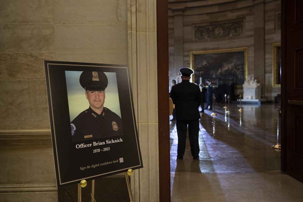 Police officer Brian Sicknick who died in rampage by Trump supporters lies in honor at US Capitol