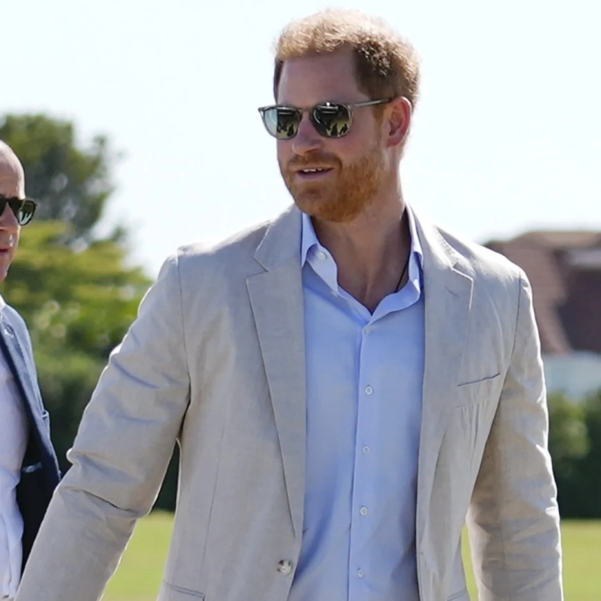 Prins Harry en Meghan, hertog en hertogin van Sussex, met beveiliger