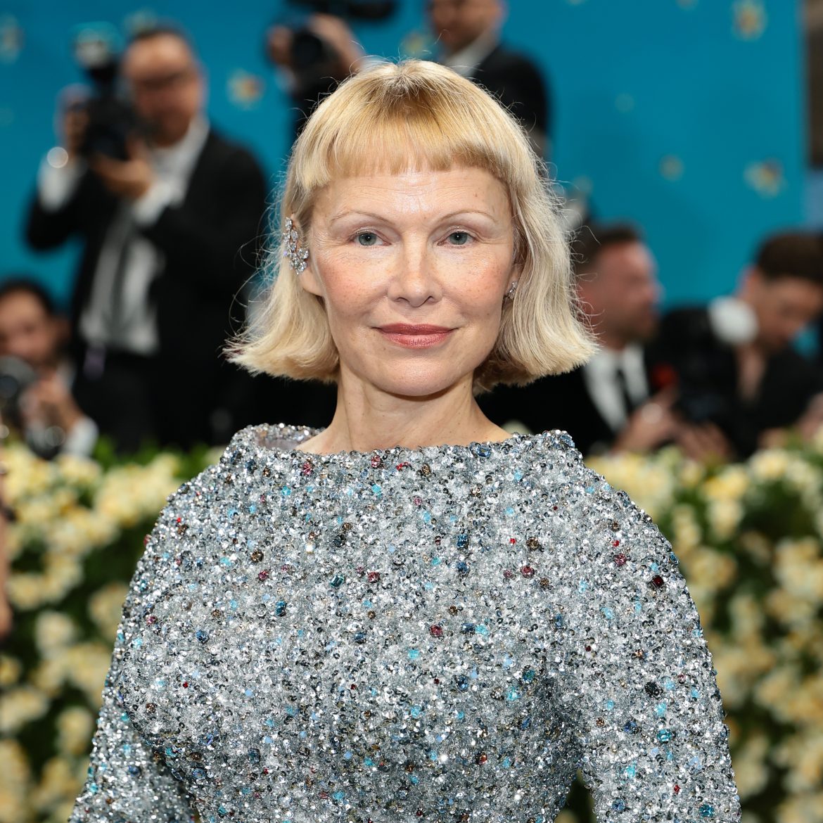 Pamela Anderson met baby bangs