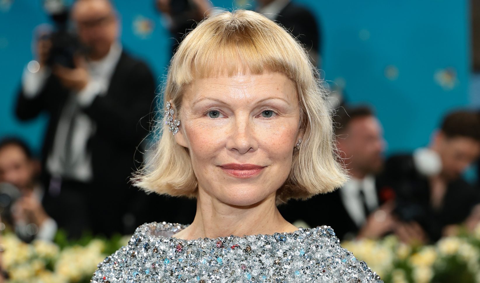 Pamela Anderson met baby bangs