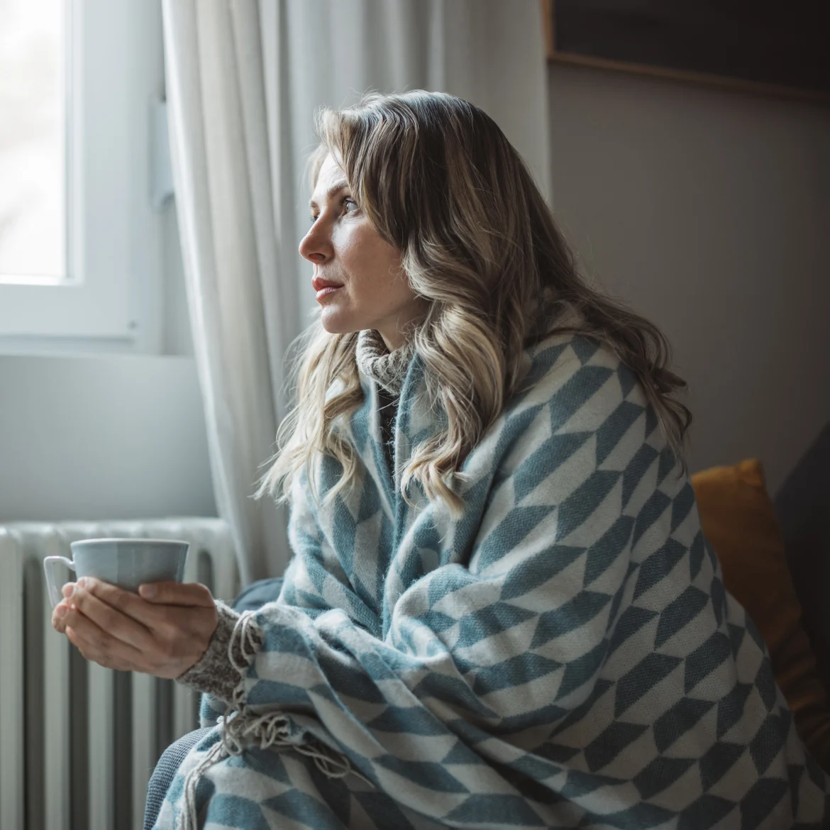 vrouw met thermostaat