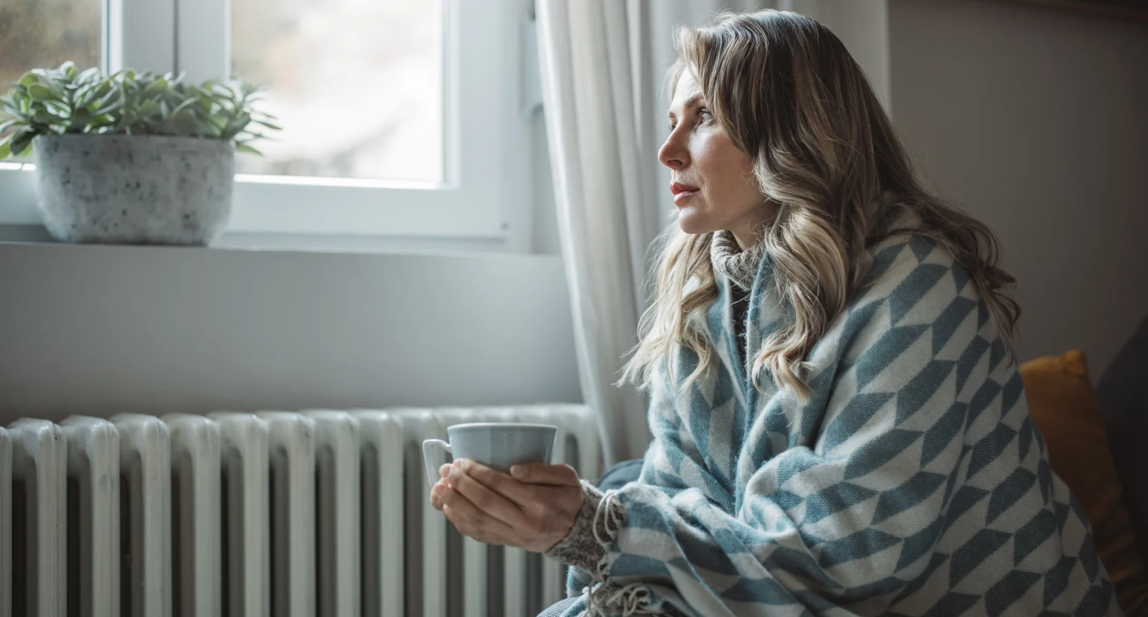 vrouw met thermostaat